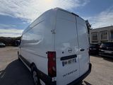 a white van that is parked in a parking lot