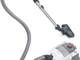 a close up of a vacuum and a hose on a white background