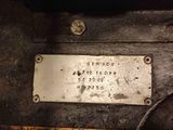 a metal plaque on the side of an old car