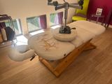 a massage table in the middle of a living room