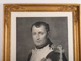 an old picture of a man in a military uniform in a gold frame