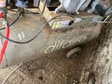 a machine that is sitting on the ground in the dirt
