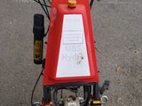 an image of a red and black motorcycle with a sign on the back
