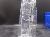 a plastic bag and a plastic bottle sitting on a table
