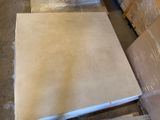 a pile of cardboard sitting on the floor next to a pile of boxes
