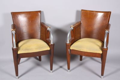 pair of art deco armchairs with leather upholstered seats