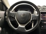 the interior of a car with a steering wheel and dashboard controls