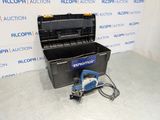 an image of a tool box with a power tool on the floor