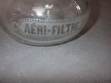 a glass jar with a label on it on a table