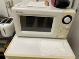 a microwave sitting on top of a counter next to a toaster oven