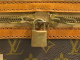 an image of a close up of a zipper on a louis vuitton