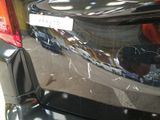 a close up of the rear end of a car with a sticker on it