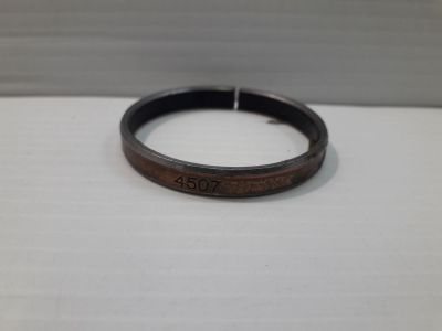 a close up of a wooden ring with a date on it