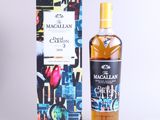 a bottle of macallan and a box on a white background