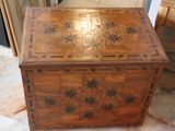 a wooden box that has a star design on it