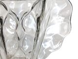 a clear glass vase with a leaf design on it