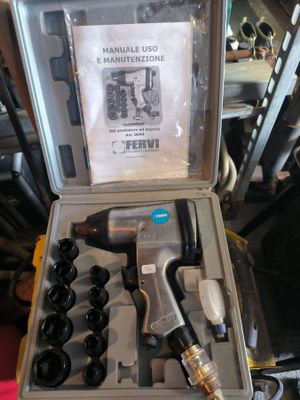 a box with tools in it sitting on a table