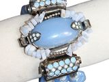 bracelet with a blue stone and glass beads on a white napkin