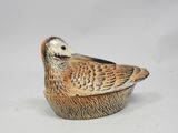 l'image d'un petit oiseau perché sur un bol