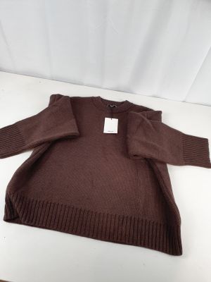 the sweater is brown and has a white tag on it