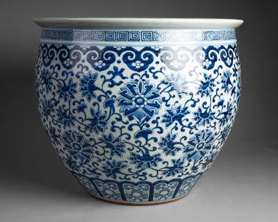 blue and white vase with a design of birds and flowers