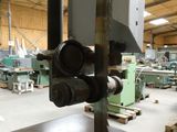 a picture of a machine shop with a saw on the table