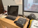 a desk with a laptop and a printer on it
