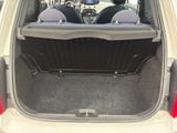 two seats in the back of a car with the trunk open