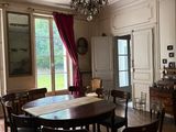 a dining room with a table and chairs in it