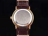 an image of a close up of a watch on a black background