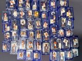 a lot of plastic figurines of people on a table