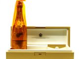 a bottle of champagne sitting in a box next to a bottle of wine