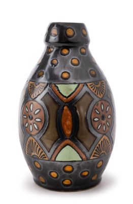 a black vase with a brown and green design on it