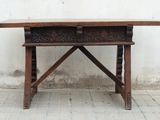 a wooden table with a drawer on top of it