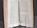 two open books sitting on a table next to each other