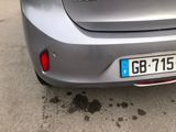 a silver car parked on the side of the road