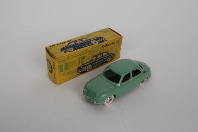a green toy car next to a yellow box