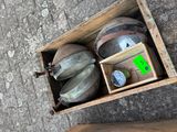 a box with a bunch of gas cans inside of it