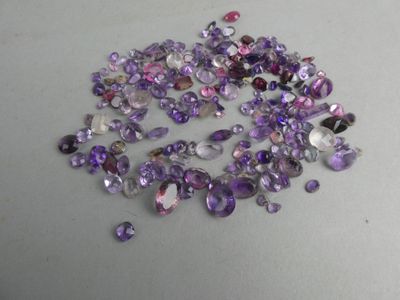some very pretty purple and white crystals on a table