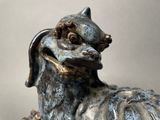 a statue of a dog that is sitting on a table
