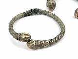 a silver bracelet that has a bunch of beads on it