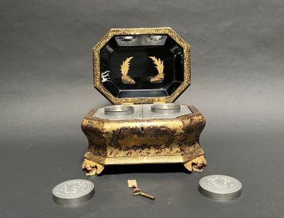a small box that has a coin in front of it
