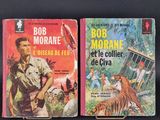 two books are sitting on a black surface one is a man and the other is a tiger