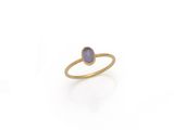 a gold ring with a blue stone in the middle