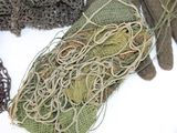 many different types of fishing nets laid out on a table