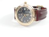 an image of a wrist watch with a blue dial