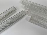 three pieces of glass that are sitting on a table