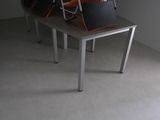 a room that has a table and chairs in it