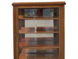 a glass display case with shelves in it