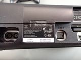 a close up of a laptop that has a battery on it